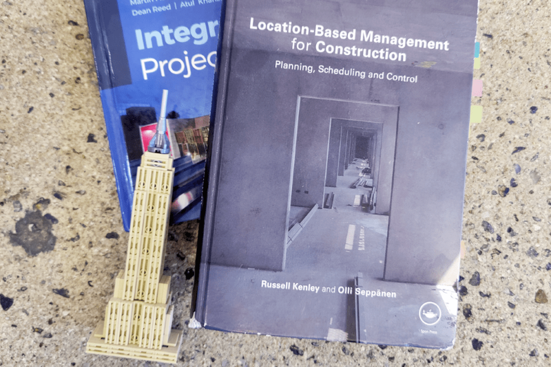 the empire state building in front of books about location based planning